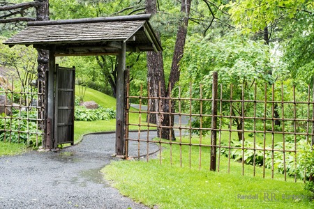 A wooden and bamboo gate protects the entrance to a Japanese tea houseの写真素材
