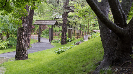 A gate protects the entrance to a Japanese tea houseの写真素材