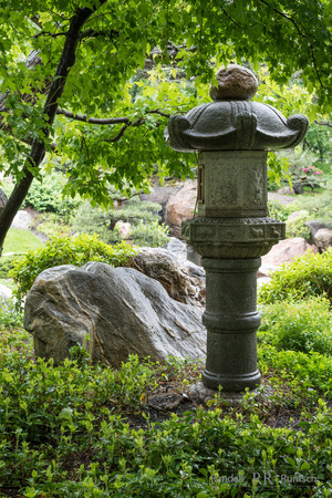 a stone lantern in a Japanese gardenの写真素材