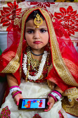 Delhi, India - September 9, 2019 : Cute Indian Kids dressed up as little Lord Krishna Radha on the occasion of Krishna Janmastami Festival in Delhi Indiaのeditorial素材