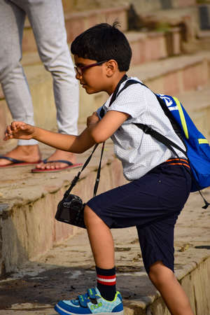 New Delhi, India - March 04, 2020: Children with Indian traditions during morning time at Yamuna river ghat in New Deli, India, Yamuna Ghat Viewのeditorial素材