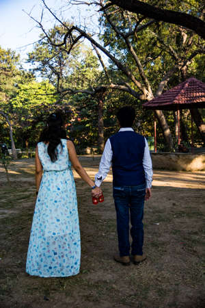 Maternity shoot pose for welcoming new born baby in Lodhi Road in Delhi India, Maternity photo shoot done by parents for welcoming their child during day time in Delhiの写真素材