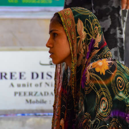 New Delhi India â March 13 2020 : Man Inside Hazrat Nizamuddin Dargah during the day time in Delhi India, Religious Darah of Nizamuddin in Delhi during EID festivalのeditorial素材