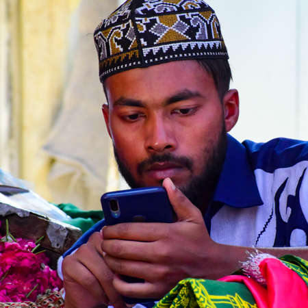 New Delhi India â March 13 2020 : Man Inside Hazrat Nizamuddin Dargah during the day time in Delhi India, Religious Darah of Nizamuddin in Delhi during EID festivalのeditorial素材