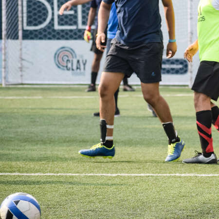 Delhi, India - July 01 2018: Footballers of local football team during game in regional Derby championship on a bad football pitch. Hot moment of football match on field of stadium â Black and Whiteのeditorial素材