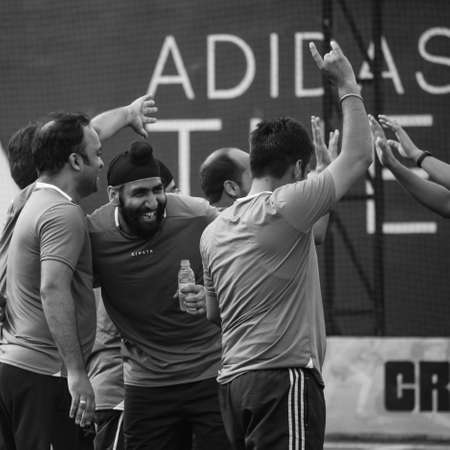 New Delhi, India - July 01 2018: Footballers of local football team during game in regional Derby championship on a bad football pitch. Hot moment of football match on grass green field of the stadiumのeditorial素材