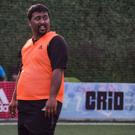 New Delhi, India - July 01 2018: Footballers of local football team during game in regional Derby championship on a bad football pitch. Hot moment of football match on grass green field of the stadiumのeditorial素材