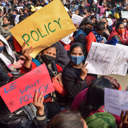 Delhi, India December 25 2021 : Delhi Contractual Guest Teachers with posters, flags and graffitiâs protesting against Delhi AAP Government for making policy, Delhi Teacher protesting Black and Whiteのeditorial素材