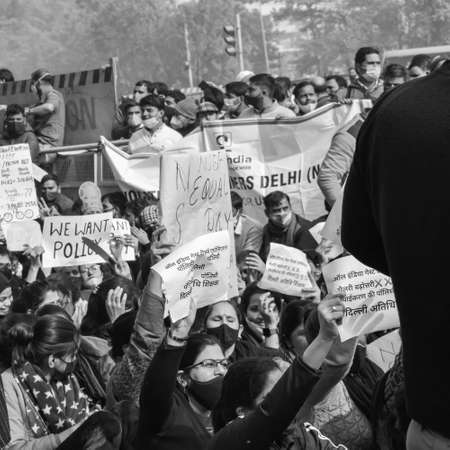 Delhi, India December 25 2021 : Delhi Contractual Guest Teachers with posters, flags and graffitiâs protesting against Delhi AAP Government for making policy, Delhi Teacher protesting Black and Whiteのeditorial素材