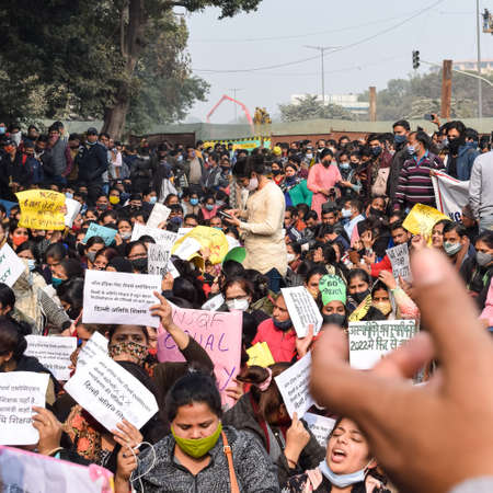 New Delhi, India December 25 2021 : Delhi Contractual Guest Teachers with posters, flags and graffitiâs protesting against Delhi AAP Government for making policy, Delhi Guest Teachers protestingのeditorial素材