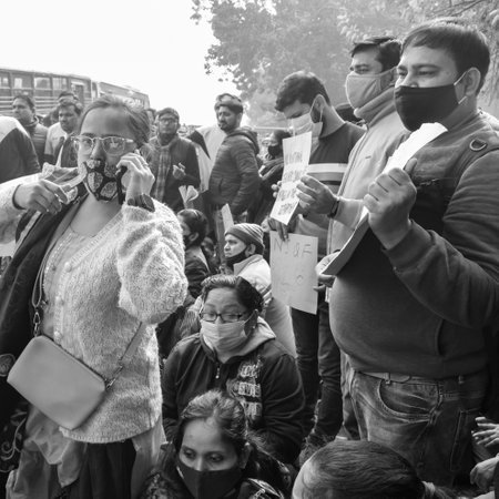 Delhi, India December 25 2021 : Delhi Contractual Guest Teachers with posters, flags and graffitiâs protesting against Delhi AAP Government for making policy, Delhi Teacher protesting Black and Whiteのeditorial素材