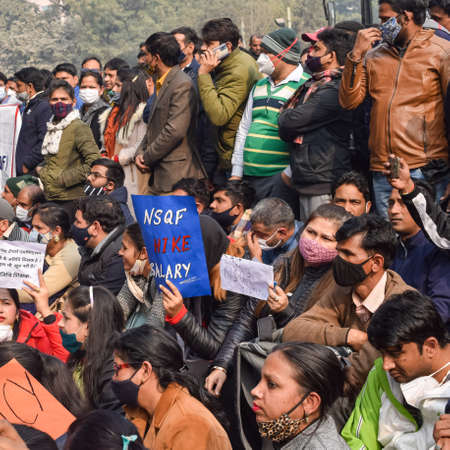 New Delhi, India December 25 2021 : Delhi Contractual Guest Teachers with posters, flags and graffitiâs protesting against Delhi AAP Government for making policy, Delhi Guest Teachers protestingのeditorial素材