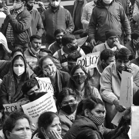 Delhi, India December 25 2021 : Delhi Contractual Guest Teachers with posters, flags and graffitiâs protesting against Delhi AAP Government for making policy, Delhi Teacher protesting Black and Whiteのeditorial素材