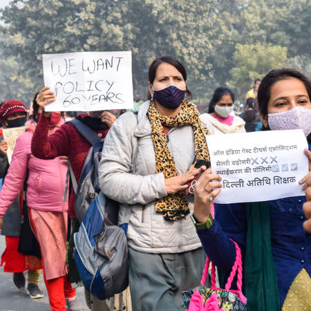 New Delhi, India December 25 2021 : Delhi Contractual Guest Teachers with posters, flags and...