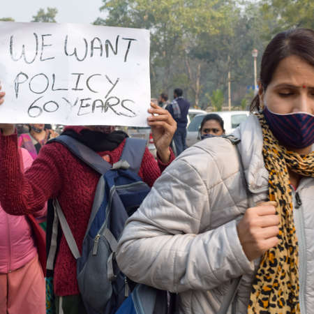 New Delhi, India December 25 2021 : Delhi Contractual Guest Teachers with posters, flags and graffitiâs protesting against Delhi AAP Government for making policy, Delhi Guest Teachers protestingのeditorial素材