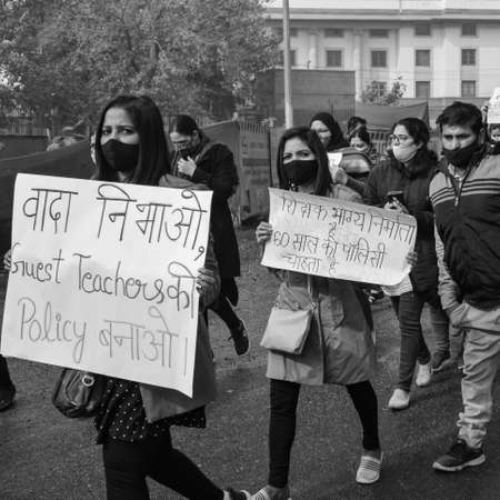 Delhi, India December 25 2021 : Delhi Contractual Guest Teachers with posters, flags and...
