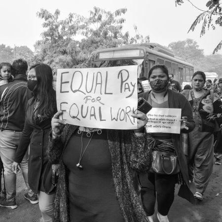 Delhi, India December 25 2021 : Delhi Contractual Guest Teachers with posters, flags and graffitiâs protesting against Delhi AAP Government for making policy, Delhi Teacher protesting Black and Whiteのeditorial素材