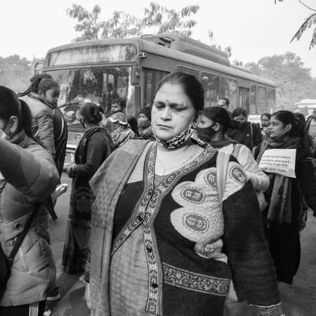 Delhi, India December 25 2021 : Delhi Contractual Guest Teachers with posters, flags and graffitiâs protesting against Delhi AAP Government for making policy, Delhi Teacher protesting Black and Whiteのeditorial素材