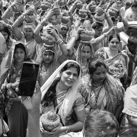 Delhi, India April 03 2022 - Women with Kalash on head during Jagannath Temple Mangal Kalash Yatra,...