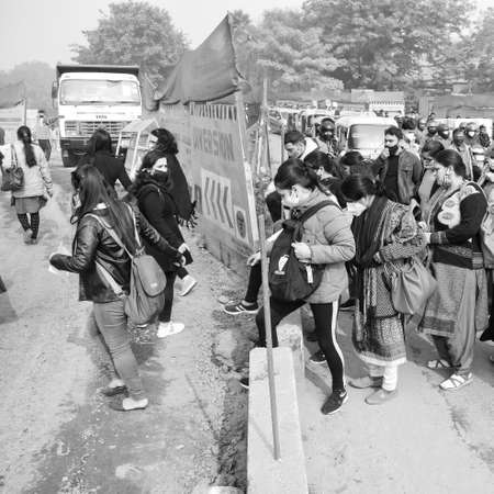 Delhi, India December 25 2021 : Delhi Contractual Guest Teachers with posters, flags and graffitiâs protesting against Delhi AAP Government for making policy, Delhi Teacher protesting Black and Whiteのeditorial素材
