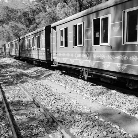 Toy Train moving on mountain slope, beautiful view, one side mountain, one side valley moving on railway to the hill, among green natural forest.Toy train from Kalka to Shimla in India-Black and Whiteのeditorial素材