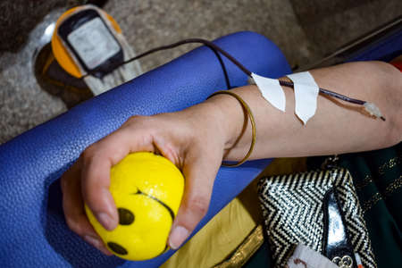 Blood donor at Blood donation camp held with a bouncy ball holding in hand at Balaji Temple, Vivek...