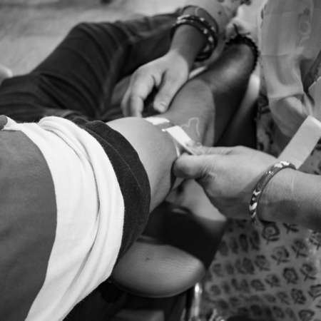 Blood donor at Blood donation camp held with a bouncy ball holding in hand at Balaji Temple, Vivek...