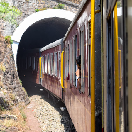 Toy Train moving on mountain slopes, beautiful view, one side mountain, one side valley moving on railway to the hill, among green natural forest. Toy train from Kalka to Shimla in India, Indian Trainのeditorial素材
