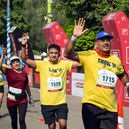 New Delhi, India - October 16 2022 - Vedanta Delhi Half Marathon race after covid in which marathon participants about to cross the finish line, Delhi Half Marathon 2022のeditorial素材