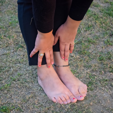 Young Indian woman practicing yoga outdoor in a park. Beautiful girl practice basic yoga pose....