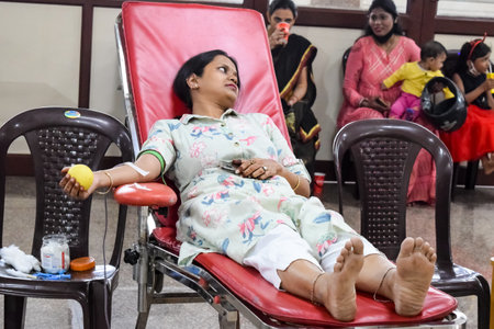 Delhi, India, June 19 2023 - Blood donor at Blood donation camp held at Balaji Temple, Vivek Vihar, Delhi, India, Image for World blood donor day on June 14 every year, Blood Donation Camp at Templeのeditorial素材