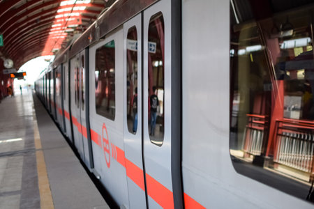 New Delhi India â August 10 2023 - Delhi Metro train arriving at Jhandewalan metro station in New Delhi, India, Asia, Public Metro departing from Jhandewalan stationのeditorial素材