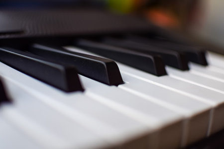 Close-up of piano keys. Piano black and white keys and Piano keyboard musical instrument placed at the home balcony during sunny day.の写真素材