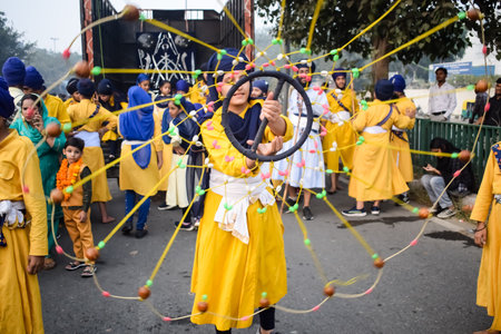 Delhi, India, October 2, 2023 - Sikhs display gatka and martial arts during annual Nagar Kirtan, Traditional, procession on account of birthday of Guru Nanak Dev ji, Nagar Kirtan in East Delhi areaのeditorial素材