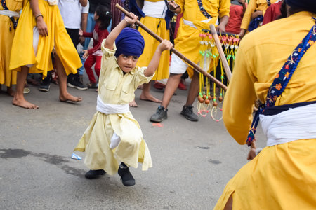 Delhi, India, October 2, 2023 - Sikhs display gatka and martial arts during annual Nagar Kirtan,...