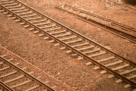 View of train Railway Tracks from the middle during daytime at Kathgodam railway station in India, Train railway track view, Indian Railway junction, Heavy industryの写真素材