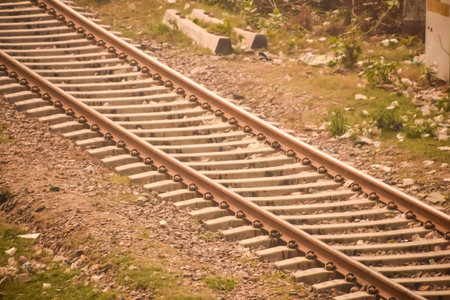 View of train Railway Tracks from the middle during daytime at Kathgodam railway station in India, Train railway track view, Indian Railway junction, Heavy industryの写真素材