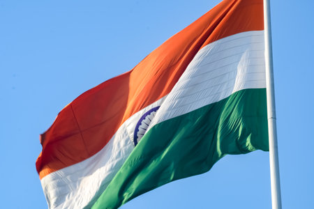 India flag flying high at Connaught Place with pride in blue sky, India flag fluttering, Indian Flag...