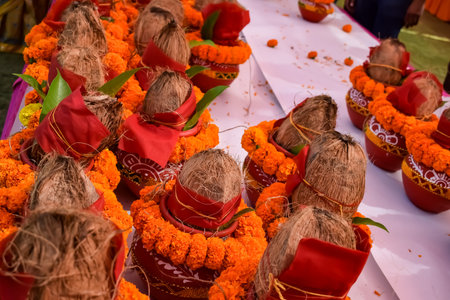 Kalash with coconut and mango leaf with floral decoration earthen pots containing sacred water....