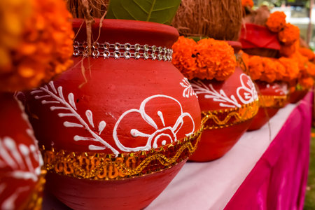 Kalash with coconut and mango leaf with floral decoration earthen pots containing sacred water....