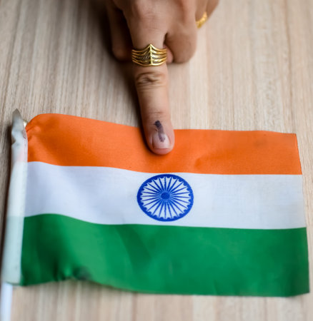 Young voter showing her ink-marked fingers after casting votes near polling booth of east Delhi, India for general Lok Sabha Elections 2024の写真素材