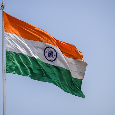 India flag flying high at Connaught Place with pride in blue sky, India flag fluttering, Indian Flag on Independence Day and Republic Day of India, tilt up shot, Waving Indian flag, Har Ghar Tirangaの写真素材