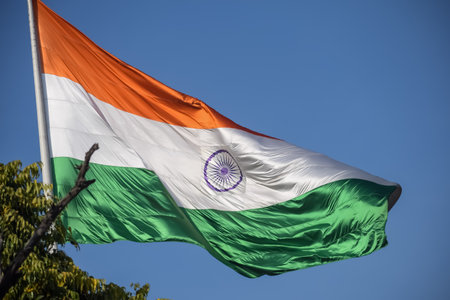 India flag flying high at Connaught Place with pride in blue sky, India flag fluttering, Indian Flag...
