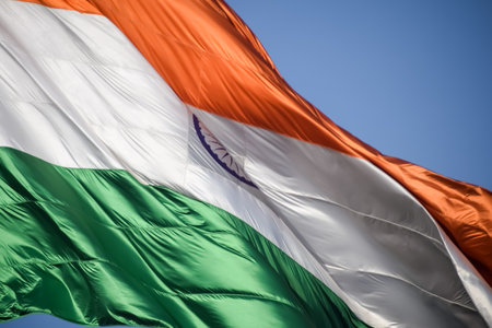 India flag flying high at Connaught Place with pride in blue sky, India flag fluttering, Indian Flag on Independence Day and Republic Day of India, tilt up shot, Waving Indian flag, Har Ghar Tirangaの写真素材