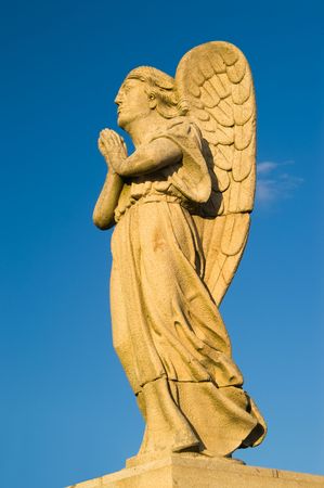 Angel statue at sunset against blue sky, Sameiro, Braga, Portugalの写真素材