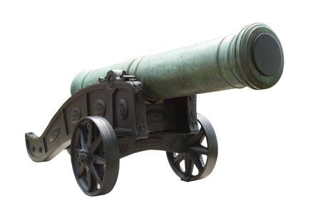 Historical weathered bronze cannon on dark cartの写真素材