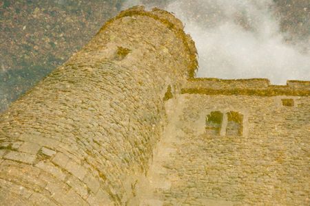 Reflection of Tower of London on mote with water and pebblesの写真素材