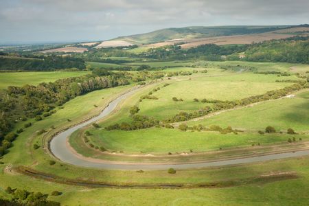 Cuckmere Haven landscape with River Cuckmere meandering in the backgroundの写真素材