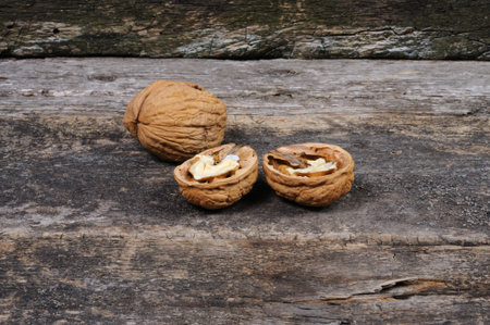 Walnuts on a wooden background. Walnuts in the shell.