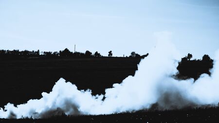 Blue smoke in the fieldの写真素材